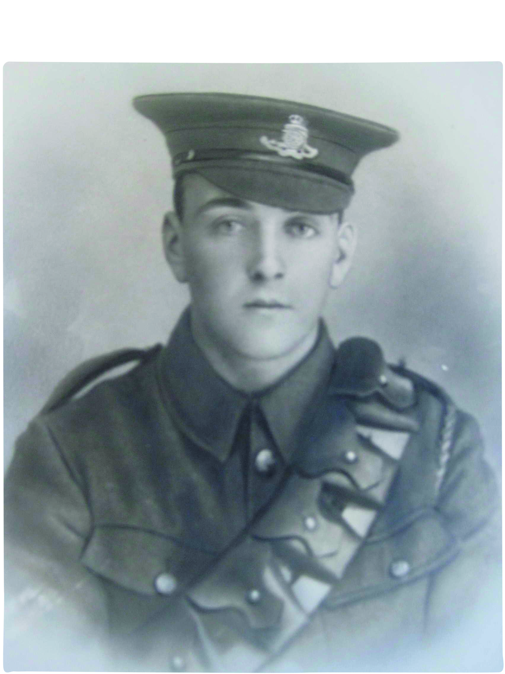 Black and white photograph of a young man in First World War uniform