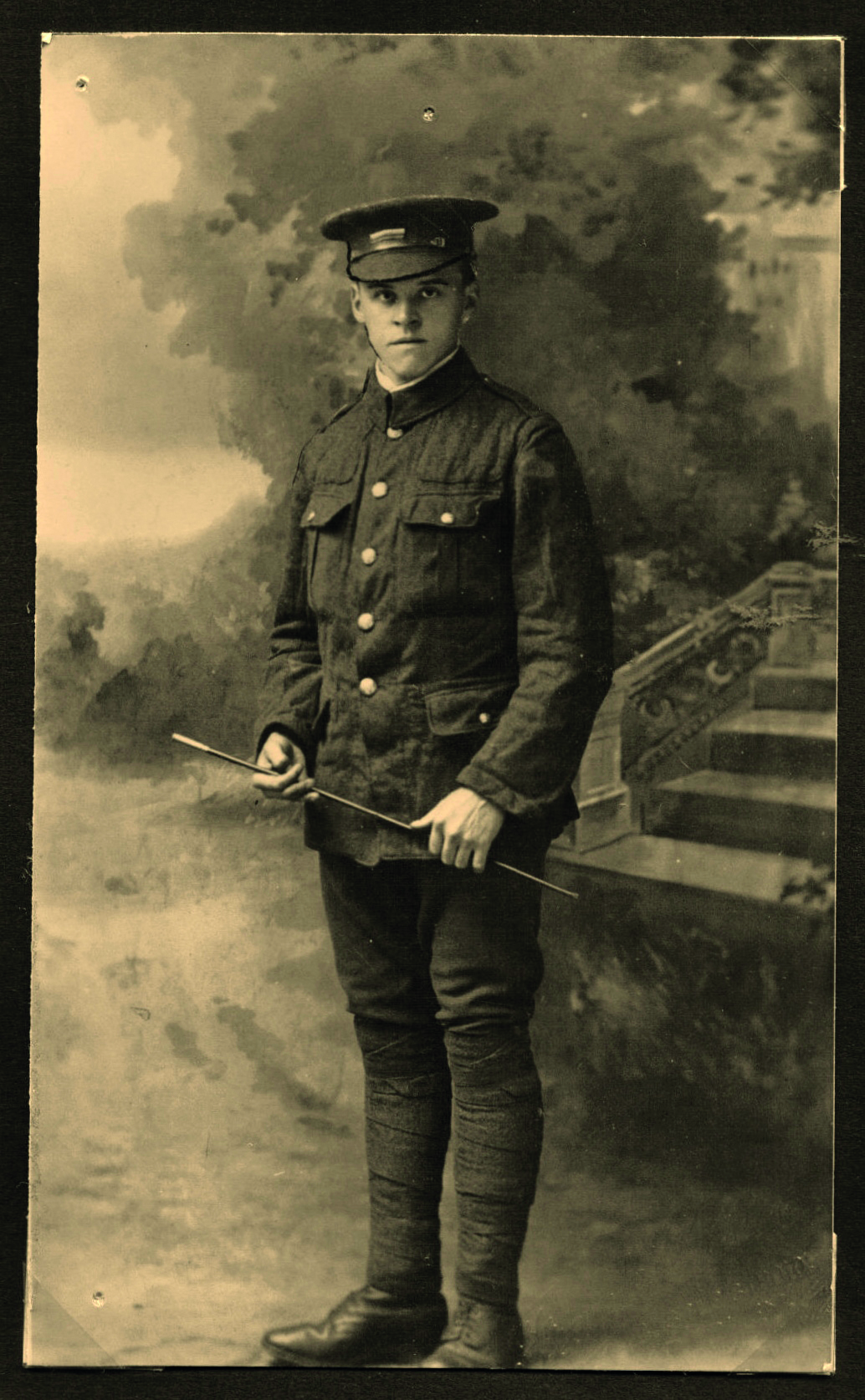Black and white photograph of a young man in military uniform