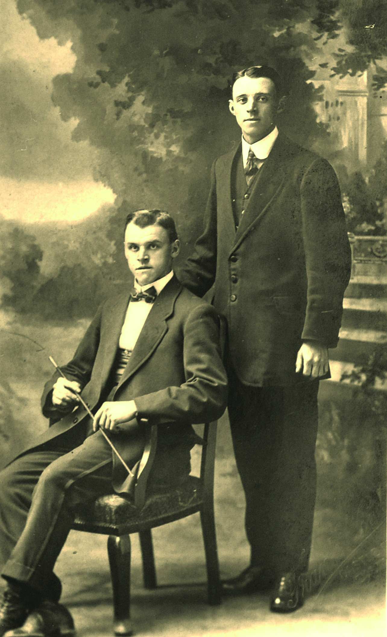 Black and white photograph of two young men in Edwardian clothes