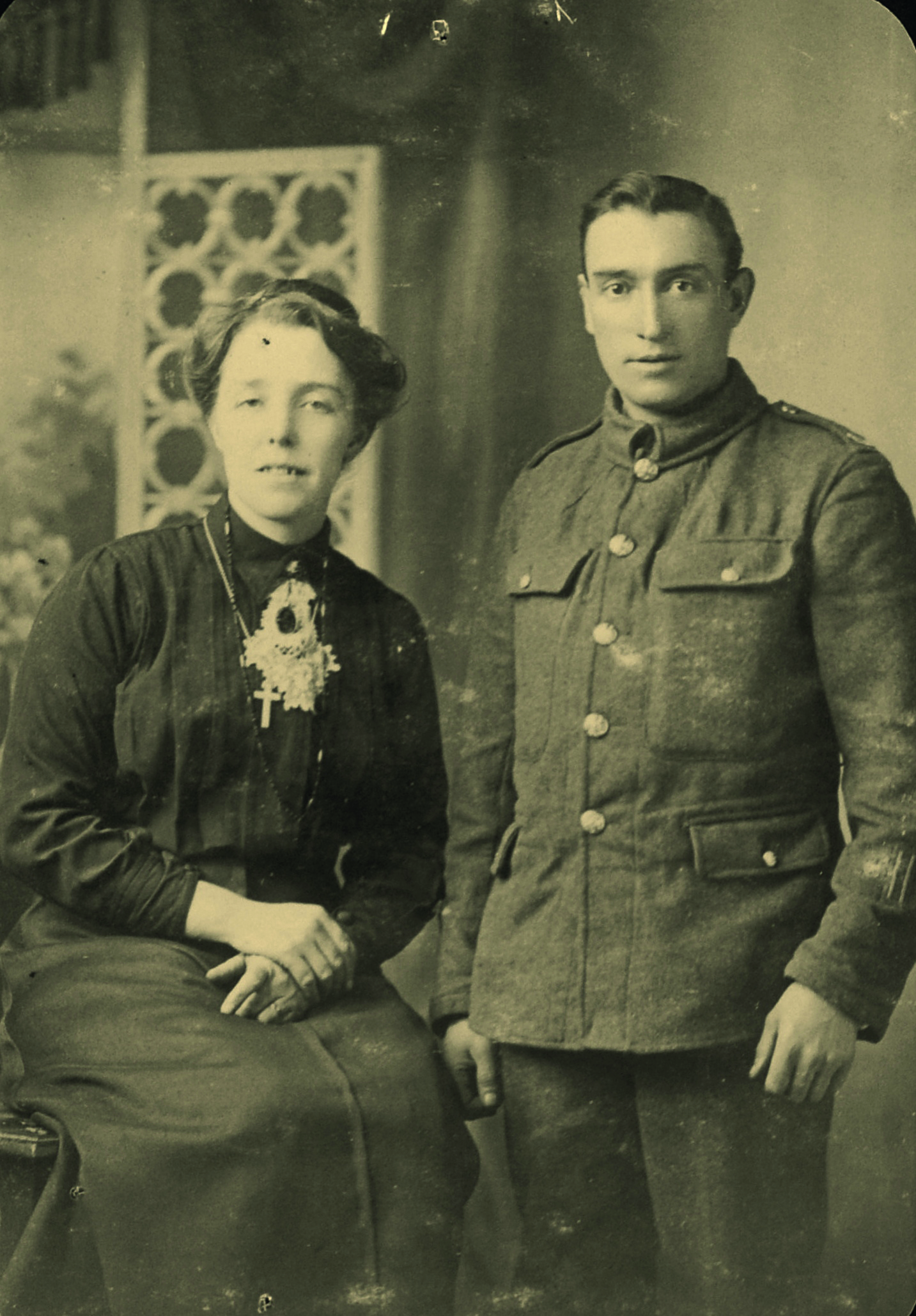 Black and white photograph of a woman and a man in First World War military uniform