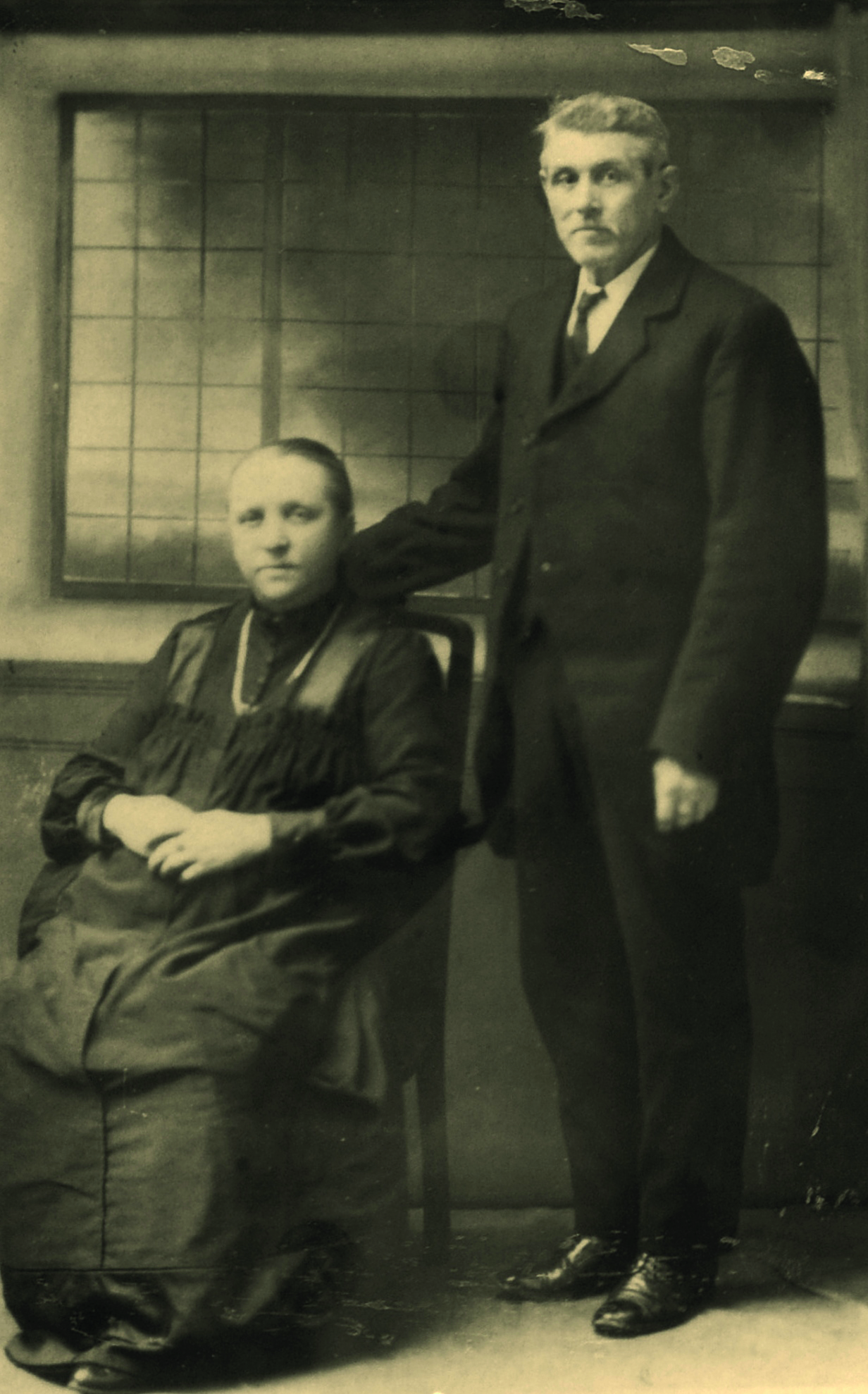 Black and white photograph of an older couple in black clothes