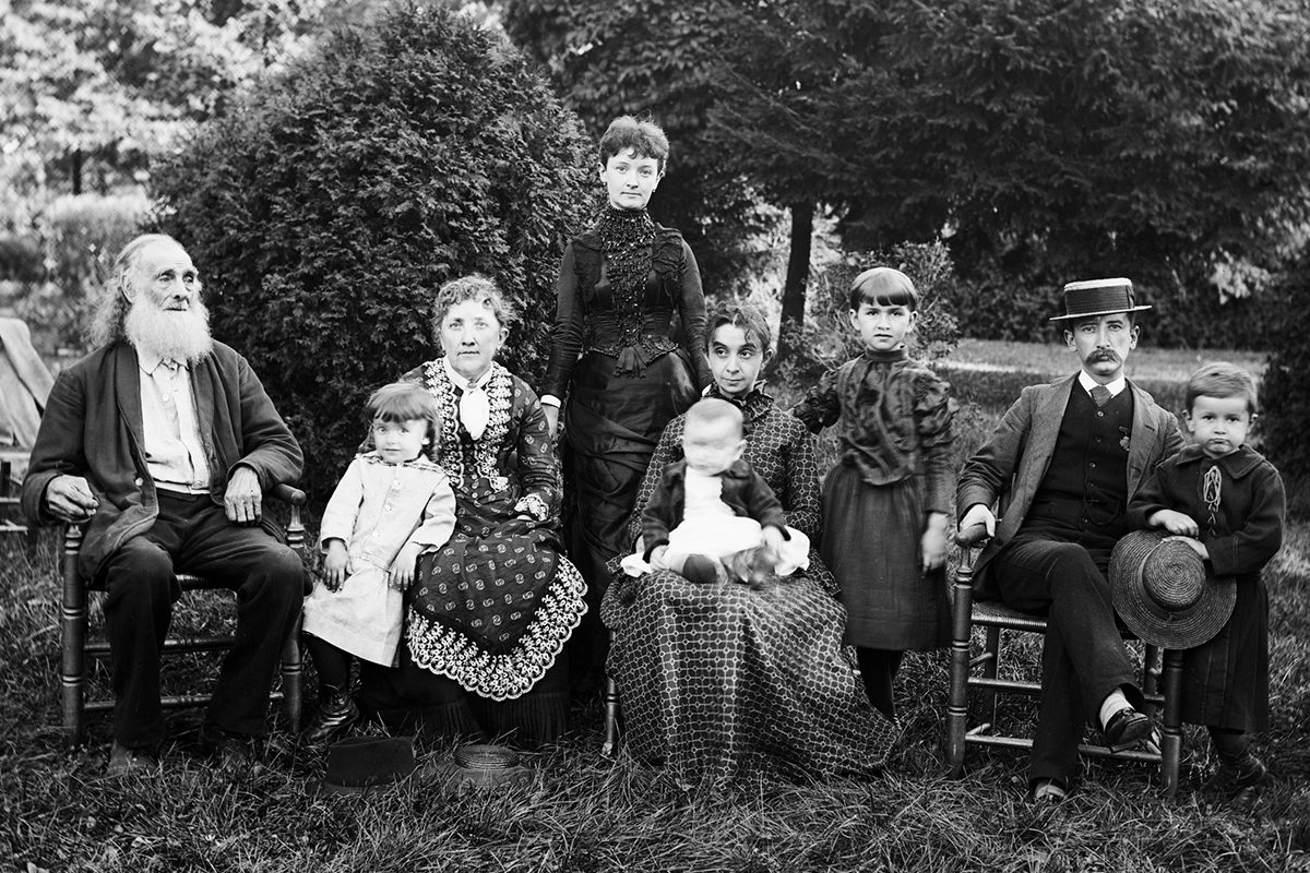 Black and white photograph of a Victorian family with grandparents, parents and children